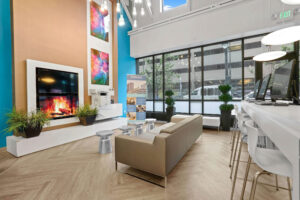 a room with a fireplace and couches