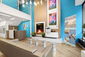 a room with a fireplace and art on the wall