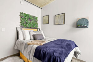 a bed with pillows and a tray on it