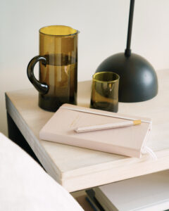 a book and a pen on a table