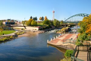 a river with a bridge and a park