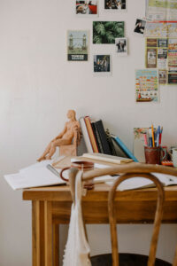 a desk with a statue on it