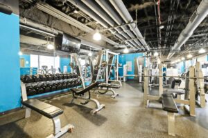 a gym with many exercise equipment