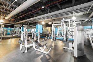 a gym with many exercise equipment