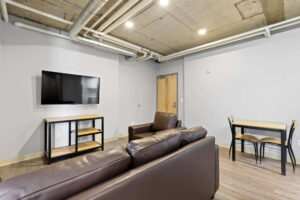 a room with a tv and couches